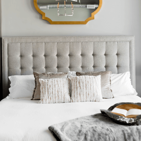 grey and white bed cushions