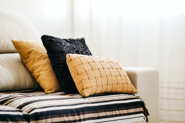 Mixed style cushions on sofa