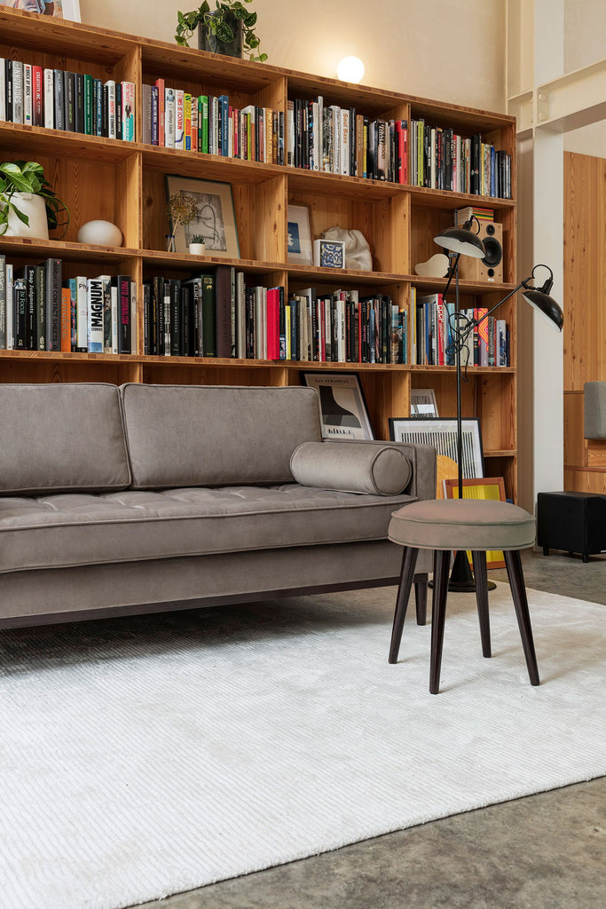 Grey sofa with footstool