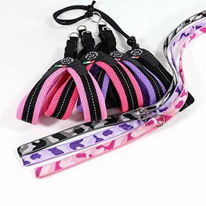 Selection of Tre Ponti Mesh Strap harnesses and Tre Ponti Camo Leashes in pink, purple, and black