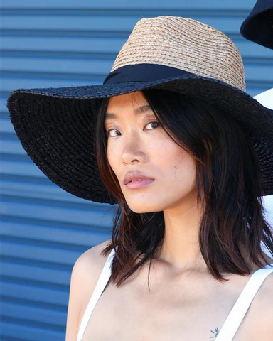 woman wearing wide-brimmed hat