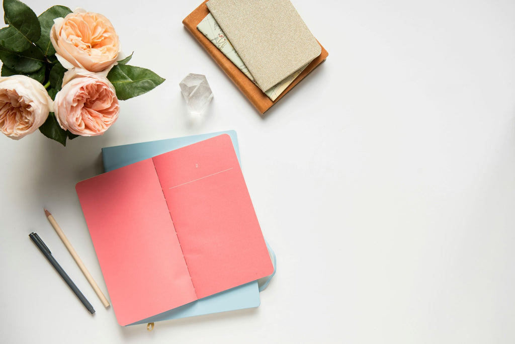 Notebooks and flowers