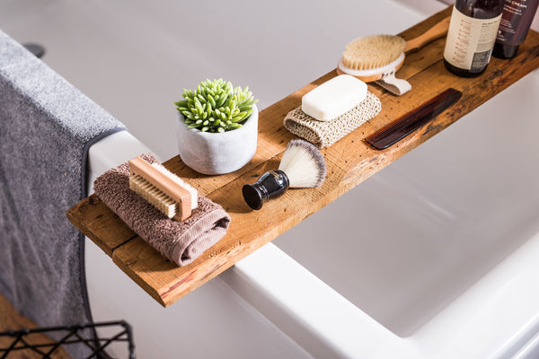 Self-care bath set-up including candles, towels and brushes