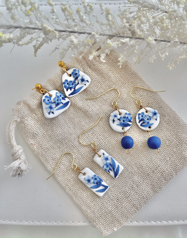 Three pairs of blue and white floral polymer clay earrings