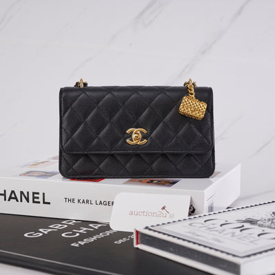 NEW 23A Chanel Black Shiny Aged Calfskin Clutch with Chain Handle