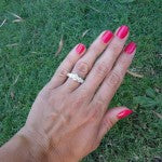 Hand Picture of Alani's Brian Gavin Graduated 5 Stone Trellis Ring