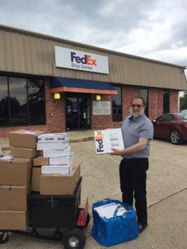 Brian Gavin drove more than five hours to arrive at a FedEx in College Station to deliver seven packages to expecting customers during Hurricane Harvey. 