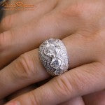 Hand Shot of 5 Stone Signature Cushion Cut Custom Ring by Brian Gavin