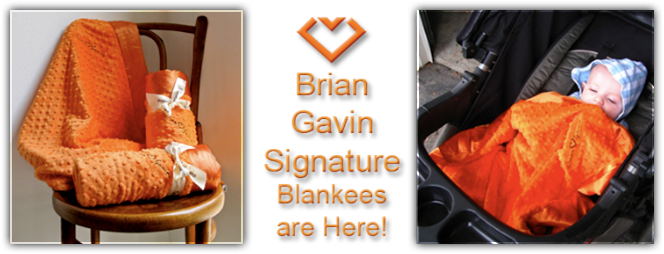 Banner with an image on the left of 3 orange blankees on a chair, and an image on the right of a baby in a stroller sleeping with the blankee. Text reads: Brian Gavin signature blankees are here!