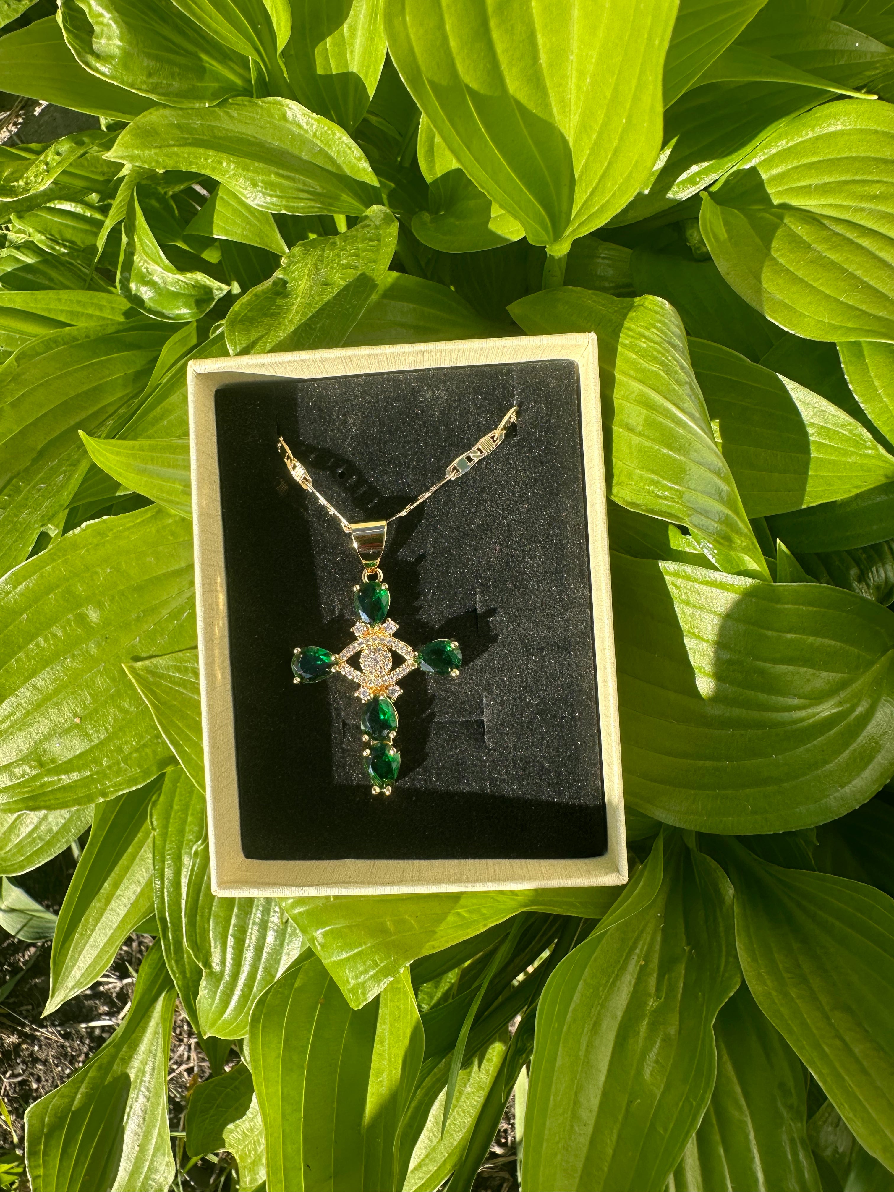 Emerald green evil eye cross