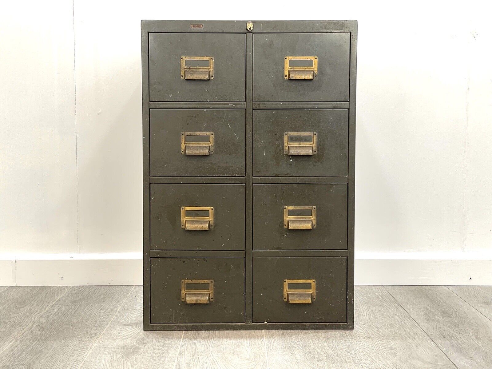 dark green filing cabinet