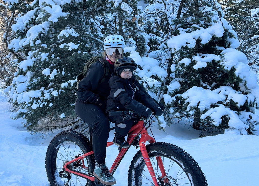 mum and son fat biking in the snow 