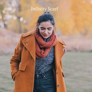 woman walking in fall wearing rust orange alpaca wool infinity scarf