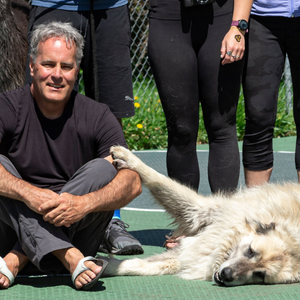 man sitting with large dog