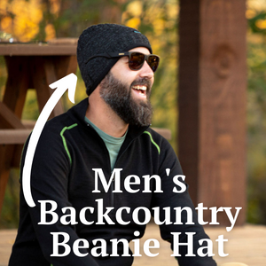 man smiling wearing black alpaca wool backcountry beanie hat