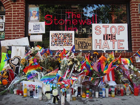 Stonewall Inn with flowers and signs.