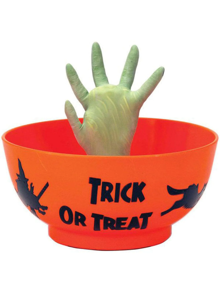 An orange candy bowl with a moving witch hand in the center.