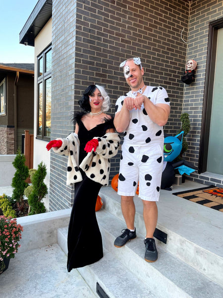 Couples costume featuring a couple dressed as Cruella de Vil and a Dalmatian.