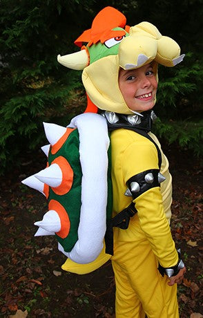 A boy wearing a DIY Bowser Halloween costume.