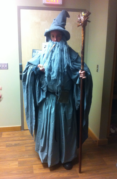 A man wearing a homemade Gandalf the Grey Halloween costume.