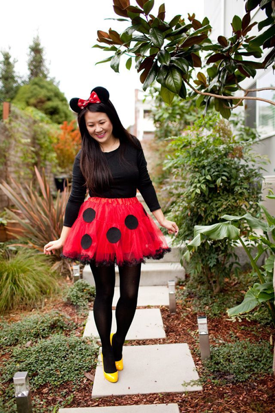 A woman wearing a DIY Minnie Mouse Halloween costume.