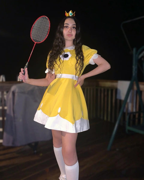 A woman wearing a DIY Princess Daisy Halloween costume.