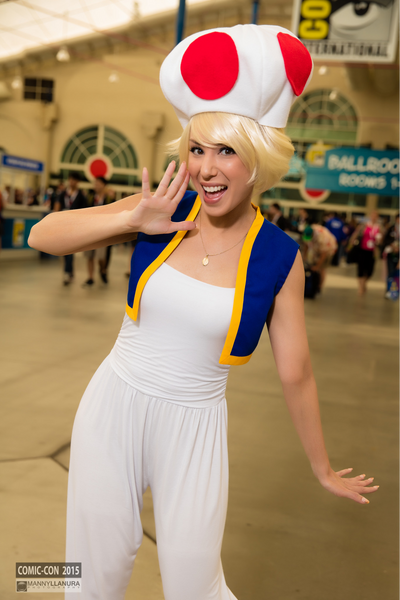 A woman cosplaying as Toad from the Super Mario Bros. video games.