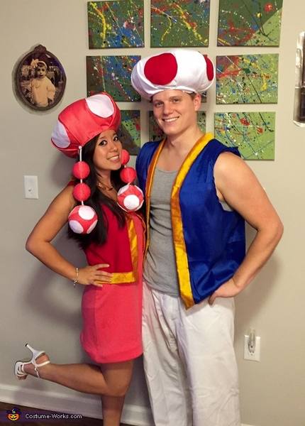 A man and woman wearing DIY Toad and Toadette Halloween costumes.