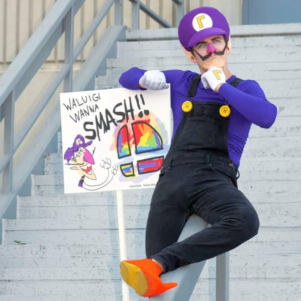 A man wearing a DIY Waluigi Halloween costume.