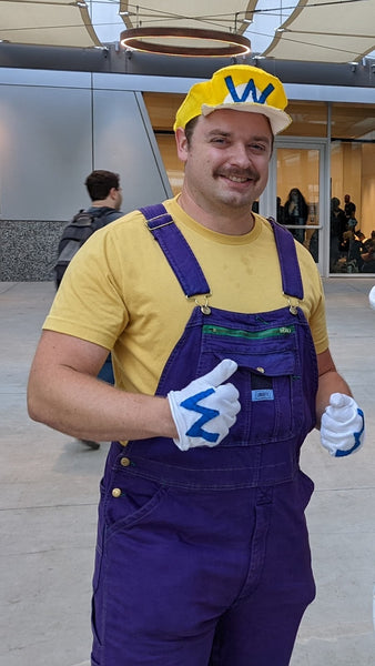 A man wearing a DIY Wario Halloween costume.