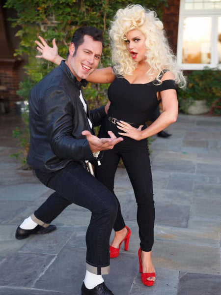 A man and woman dressed as Danny Zuko and Sandy Olsson from Grease.