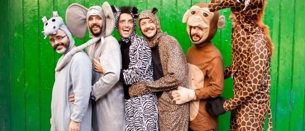 A group of men wearing animal pajama onesie Halloween costumes.