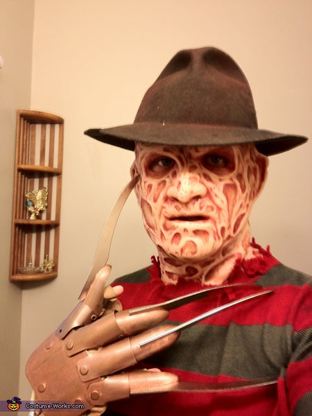 A man wearing a Freddy Kreuger Halloween costume.