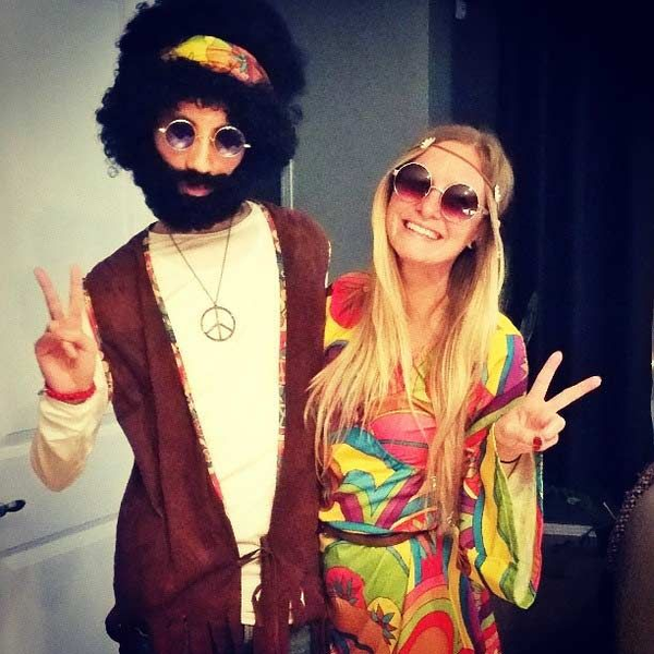 Couples costume featuring a couple dressed in matching hippie costumes.