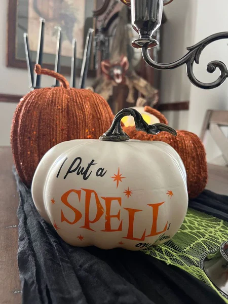 A white pumpkin decorated with the words "I put a spell on you" from Hocus Pocus