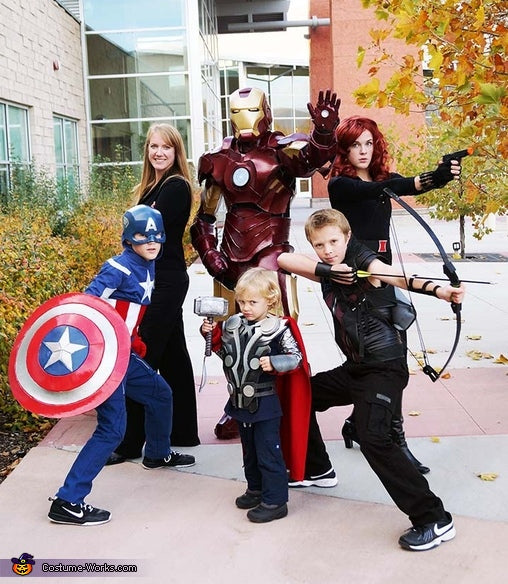 A family wearing Marvel's Avengers Halloween costumes, featuring Pepper Potts, Iron Man, Black Widow, Captain America, Thor, and Hawkeye.