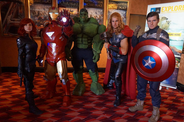 A group of people dressed in an Avengers group Halloween costume, featuring Black Widow, Hulk, Iron Man, Thor, and Captain America.