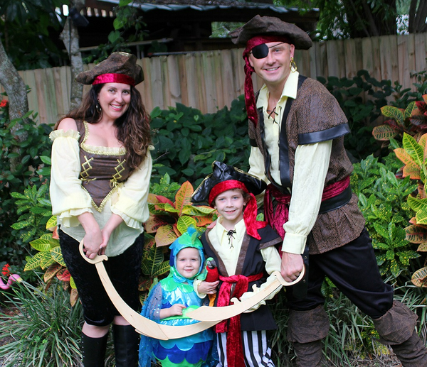 A family dressed in pirate Halloween costumes.