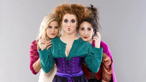 Couples costume featuring three women dressed as the Sanderson Sisters from Hocus Pocus.