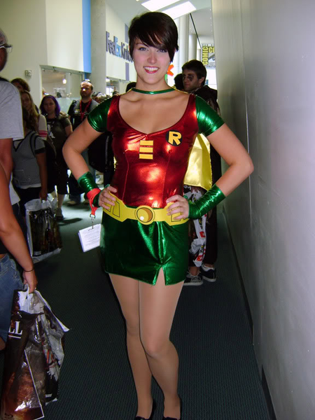 A woman dressed in a Sexy Female Robin Halloween costume.