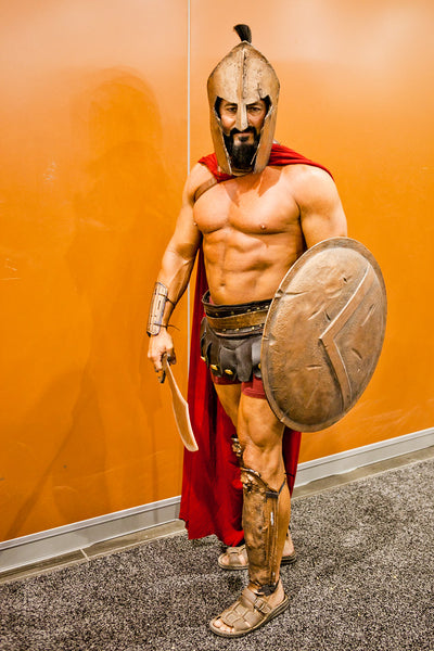 A man dressed in a sexy Roman Gladiator Halloween costume.