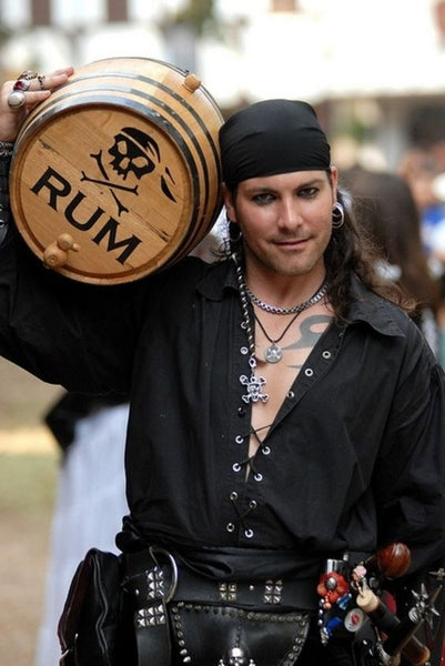 A man dressed in a sexy pirate Halloween costume.