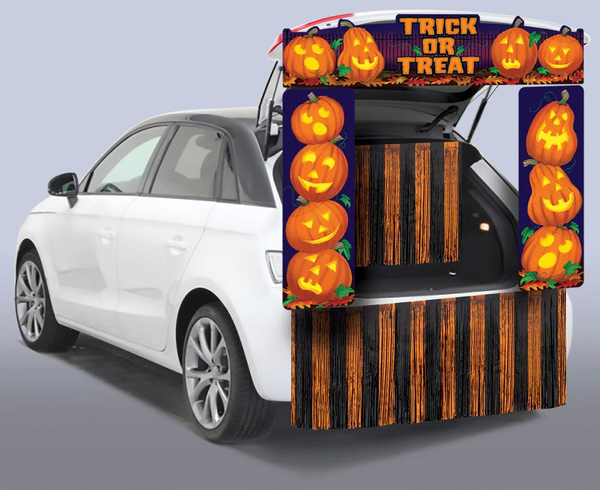 Pumpkin-themed trunk-or-treat car decoration.