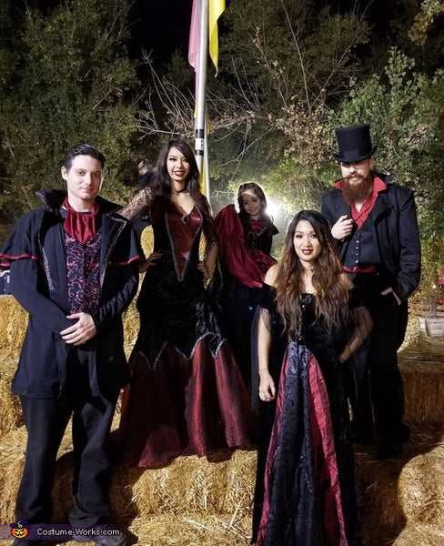 A family of five dressed in a vampire-themed group Halloween costume.