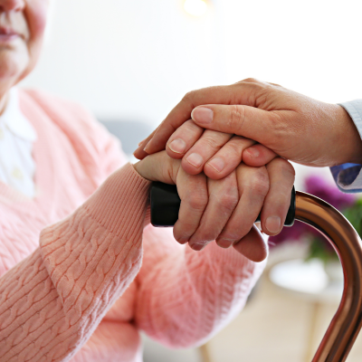 Elderly Women Hand On Cane