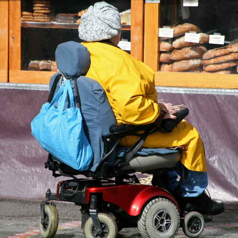 Person Shopping On Mobility Scooter