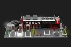 Welcome to Tesla Centers today the world is changing and electric vehicles are coming onto our roads to make way for ecology, it seems necessary to me to build this set. Your kids will also be able to build it and have fun with the set. Inspired by current Tesla centers and suitable for modular. So that it fits perfectly into the existing set. The set consists of a space dedicated to the sale of Tesla vehicles at the seller and its color palette wall to personalize his Tesla vehicle, as well as a space for the technician with 2 garage doors that can be opened thanks to a roller door system so that cars can enter the technical center enter and carry out maintenance or updates to the vehicle. With its 3 superchargers in the electric vehicle parking lots, up to 3 cars can be charged at the same time. This set also includes 4 vehicles: one Model Y, two Model S and a Cybertruck. It's a great opportunity for Lego enthusiasts and Tesla fans to build their own detailed and functional hub.