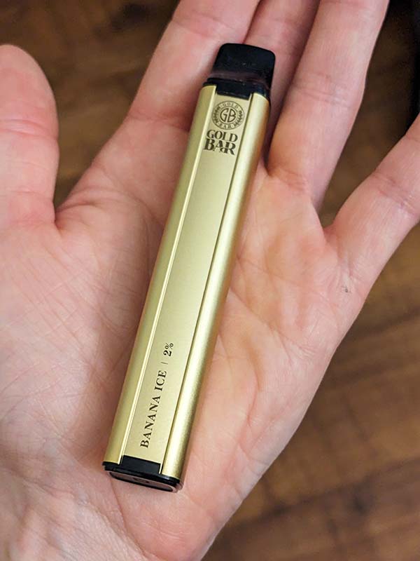 Vape Gold Gold Bar disposable vape held in a hand