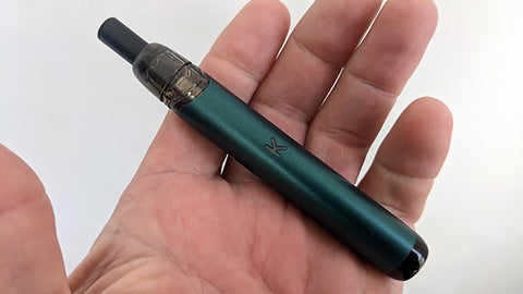 A Kiwi Vape Pen device held in a hand