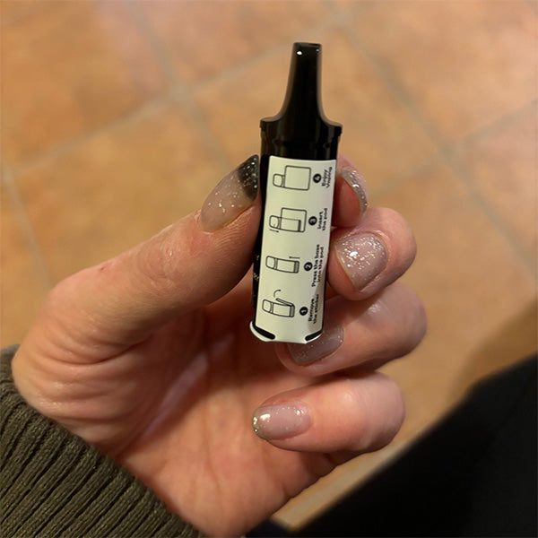 A Lost Mary Tappo Pod Kit Pod with safety labels and mouthpiece cap
